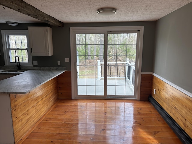 7 Kathryn St, Gorham, ME 04038 - interior space with wooden walls, a textured ceiling, wainscoting, and a sink