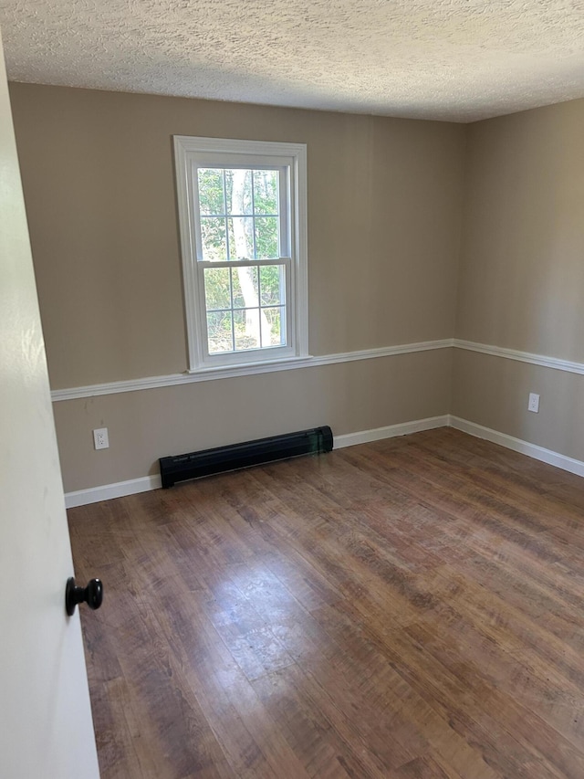 7 Kathryn St, Gorham, ME 04038 - empty room featuring baseboards, a textured ceiling, and wood finished floors