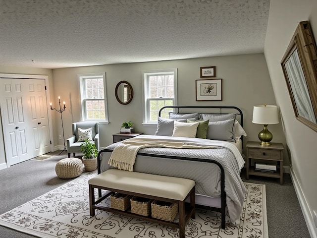 7 Kathryn St, Gorham, ME 04038 - carpeted bedroom featuring a textured ceiling, baseboards, and a closet