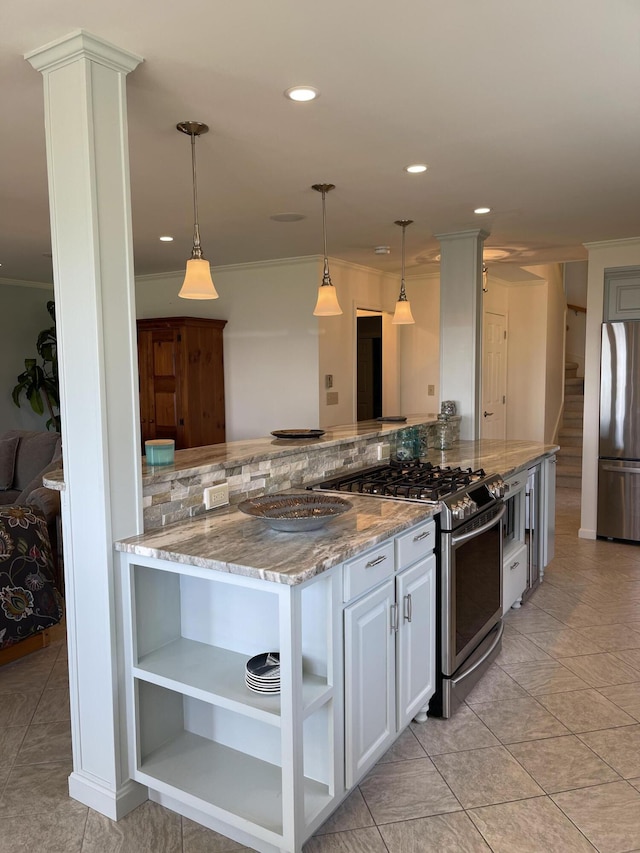 kitchen with light stone countertops, stainless steel appliances, white cabinets, and ornamental molding