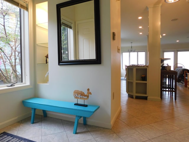 120 Bellevue St Unit 4, Owls Head, ME 04854 - hall with baseboards, tile patterned floors, a chandelier, recessed lighting, and ornate columns