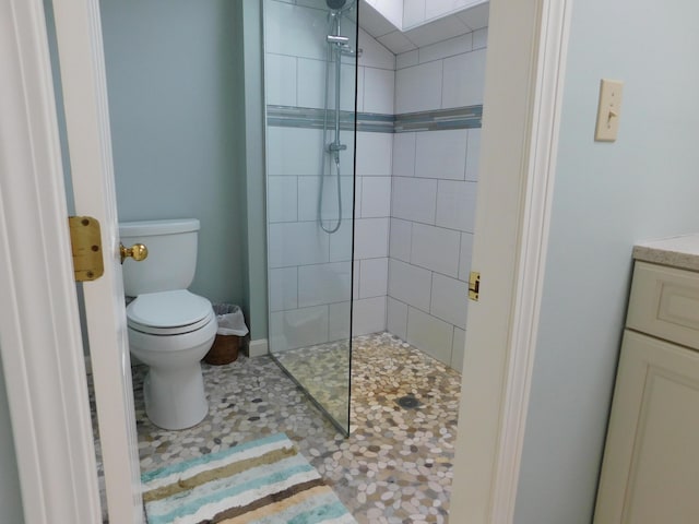 120 Bellevue St Unit 4, Owls Head, ME 04854 - bathroom featuring a tile shower, toilet, and vanity