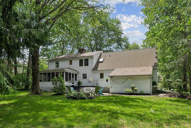 14 Pine Ledge Dr, Scarborough, ME 04074 - back of house with a sunroom, a lawn, a chimney, and roof with shingles