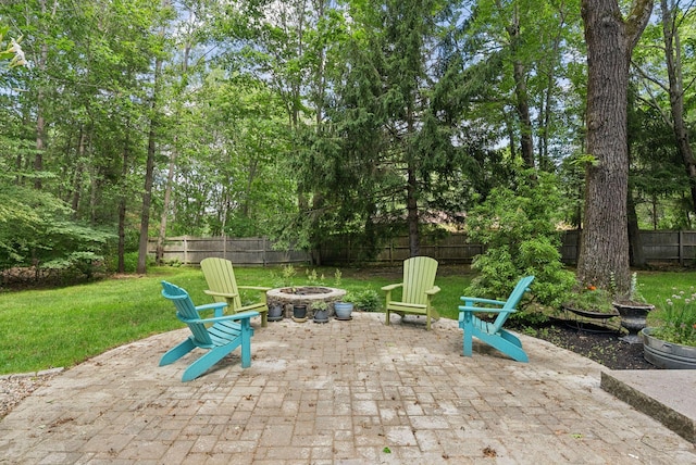 14 Pine Ledge Dr, Scarborough, ME 04074 - fenced backyard with an outdoor fire pit and a patio