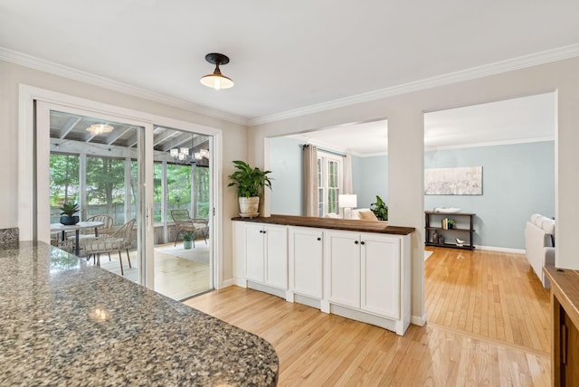14 Pine Ledge Dr, Scarborough, ME 04074 - kitchen featuring light wood-type flooring, radiator heating unit, crown molding, and plenty of natural light