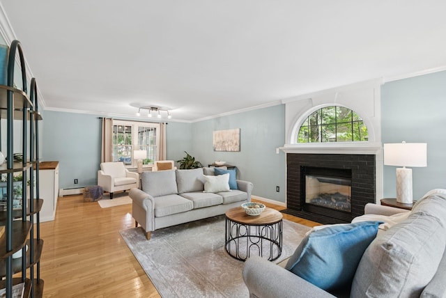 14 Pine Ledge Dr, Scarborough, ME 04074 - living area with light wood-style floors, crown molding, a brick fireplace, and a baseboard heating unit