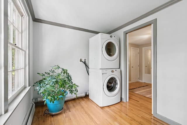 14 Pine Ledge Dr, Scarborough, ME 04074 - laundry area with stacked washer / drying machine, ornamental molding, healthy amount of natural light, light wood-style flooring, and baseboard heating
