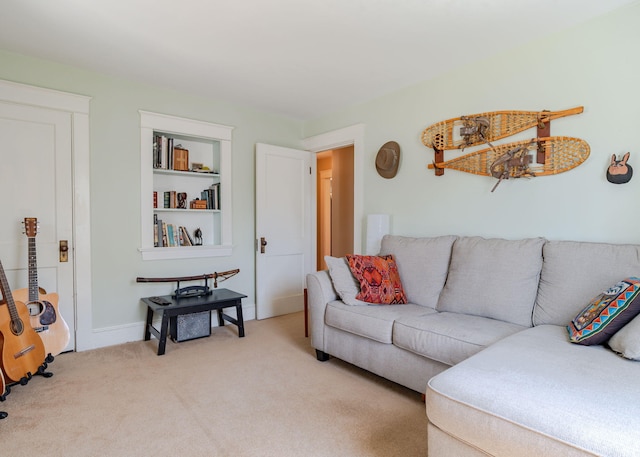 living room with baseboards and light carpet