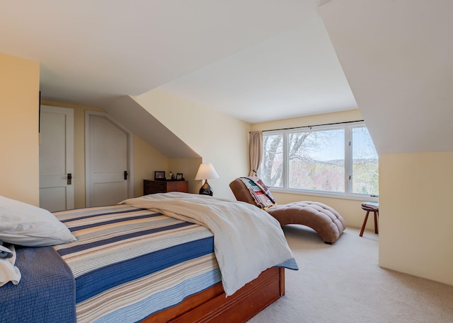 carpeted bedroom featuring vaulted ceiling