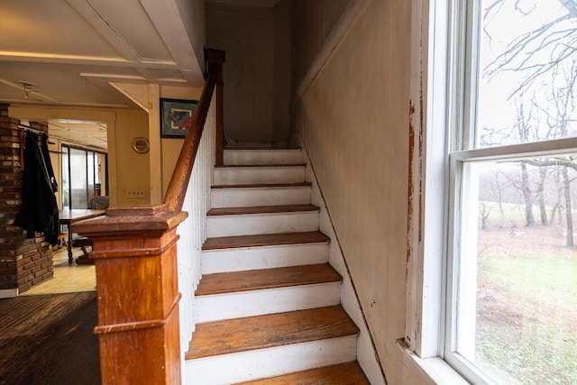 stairway with wood finished floors