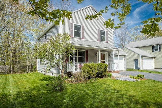 134 Yale St, Portland, ME 04103 - view of front of house featuring covered porch, a front yard, a garage, and asphalt driveway