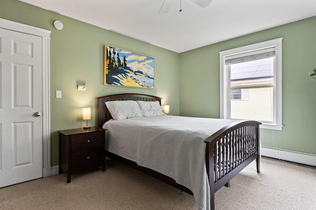 134 Yale St, Portland, ME 04103 - carpeted bedroom with a baseboard heating unit, a ceiling fan, and baseboards