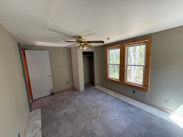 633 Norway Rd, Harrison, ME 04040 - unfurnished bedroom with baseboards and ceiling fan