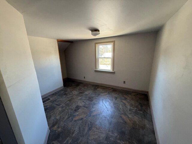 633 Norway Rd, Harrison, ME 04040 - unfurnished room with lofted ceiling, baseboards, and visible vents