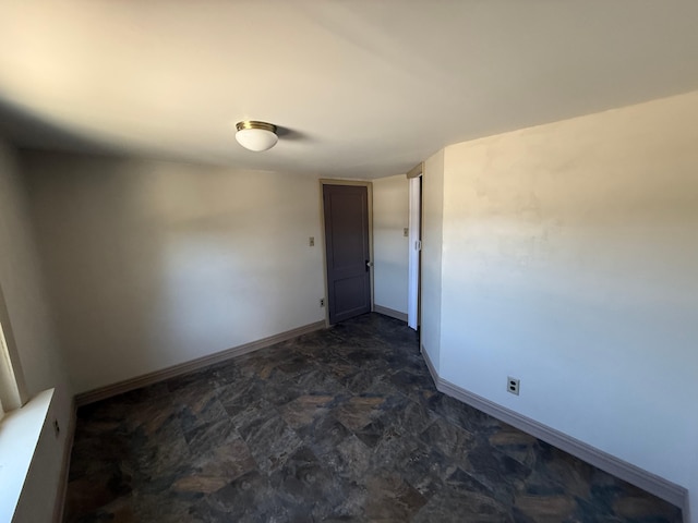 633 Norway Rd, Harrison, ME 04040 - empty room featuring baseboards and stone finish floor