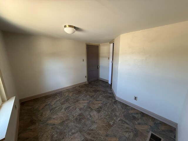 633 Norway Rd, Harrison, ME 04040 - unfurnished room featuring baseboards, stone finish floor, and visible vents