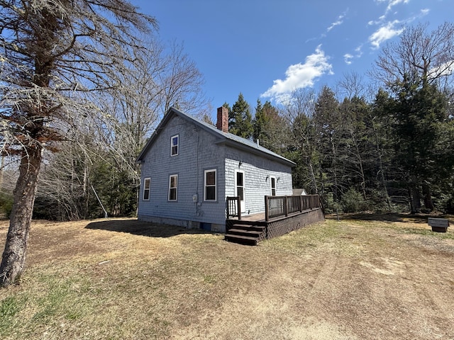 633 Norway Rd, Harrison, ME 04040 - view of side of property featuring a chimney, a deck, and a yard