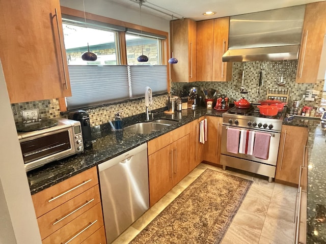 16 Howard Ave Unit 16, Wells, ME 04090 - kitchen with brown cabinetry, wall chimney range hood, a sink, backsplash, and stainless steel appliances