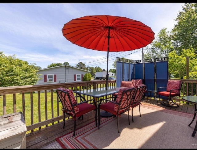 16 Howard Ave Unit 16, Wells, ME 04090 - wooden deck featuring a lawn and outdoor dining space
