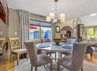 16 Howard Ave Unit 16, Wells, ME 04090 - dining room with light wood-style flooring and a chandelier
