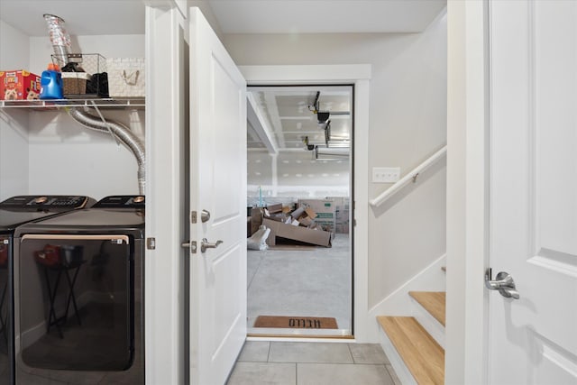 washroom featuring laundry area, tile patterned flooring, and washing machine and clothes dryer