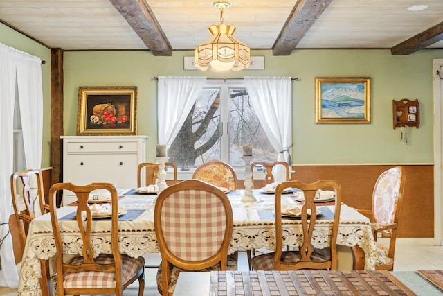 dining area featuring wood ceiling, beam ceiling, an inviting chandelier, and light tile patterned flooring