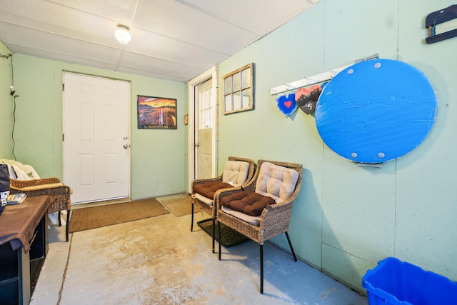 entrance foyer with unfinished concrete flooring