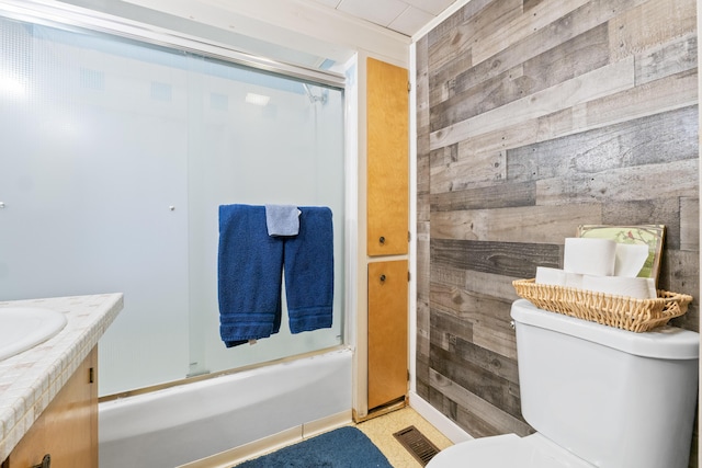 bathroom featuring wood walls, visible vents, toilet, and vanity