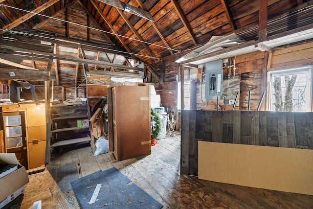 basement with wood ceiling, wooden walls, and electric panel