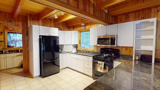 86 Webb Cove Dr, Lowell, ME 04493 - kitchen featuring wood walls, black appliances, beamed ceiling, and a sink