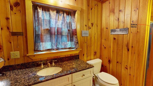 86 Webb Cove Dr, Lowell, ME 04493 - bathroom with toilet, wood walls, and vanity