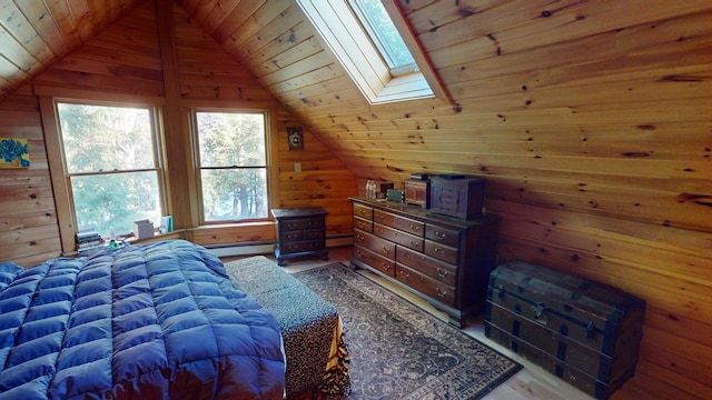86 Webb Cove Dr, Lowell, ME 04493 - bedroom featuring baseboard heating, wooden ceiling, vaulted ceiling with skylight, and wood walls