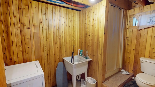 86 Webb Cove Dr, Lowell, ME 04493 - clothes washing area with washer / clothes dryer, wooden walls, laundry area, and a sink