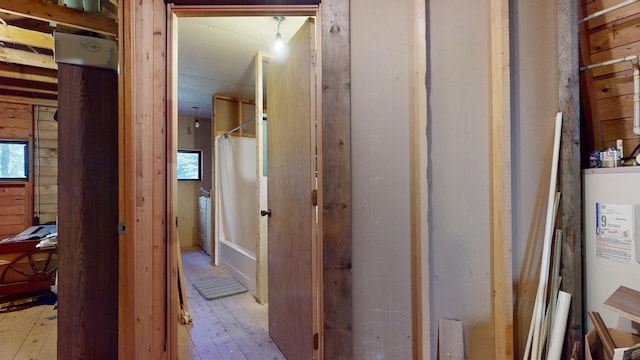 86 Webb Cove Dr, Lowell, ME 04493 - interior space with wood-type flooring, water heater, and a healthy amount of sunlight