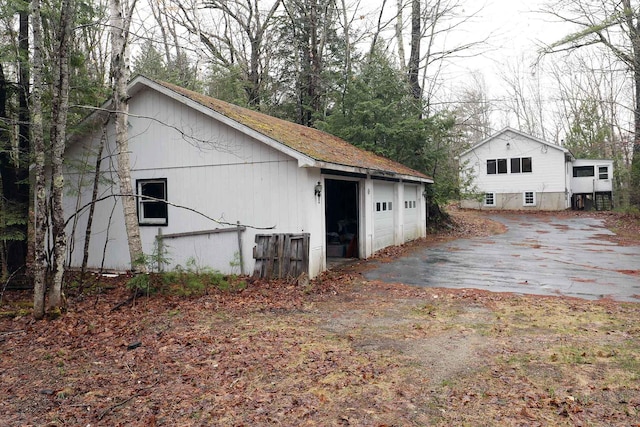 exterior space featuring a detached garage