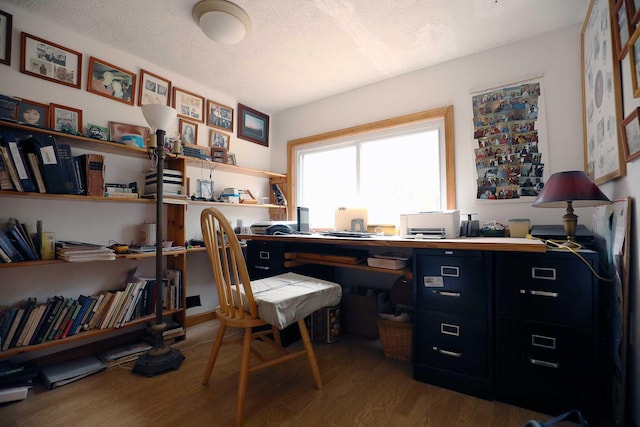 office area featuring a textured ceiling and wood finished floors