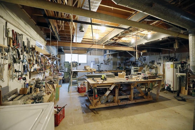 interior space with gas water heater and a workshop area