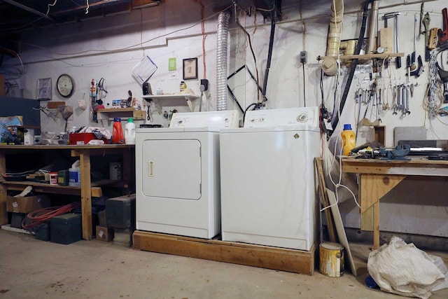 laundry room featuring a workshop area, washer and dryer, and laundry area
