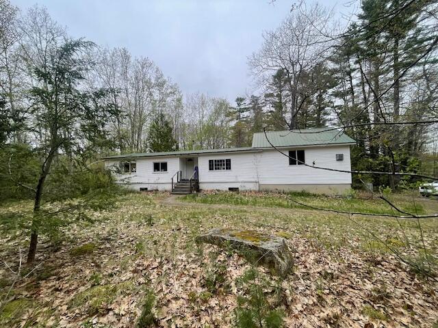 56 Neck Rd, West Gardiner, ME 04345 - view of front of property featuring entry steps and view of scattered trees