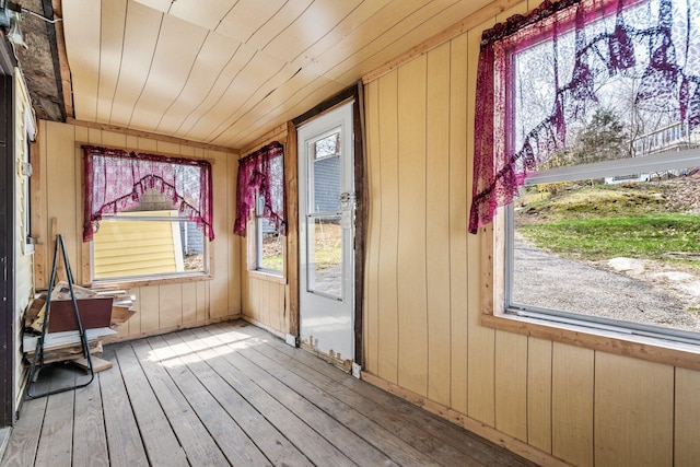unfurnished sunroom featuring plenty of natural light