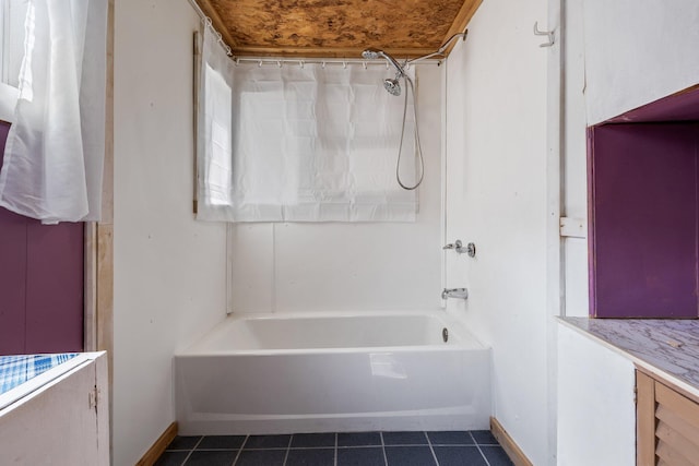 full bathroom with baseboards, tile patterned flooring, and shower / bath combination with curtain