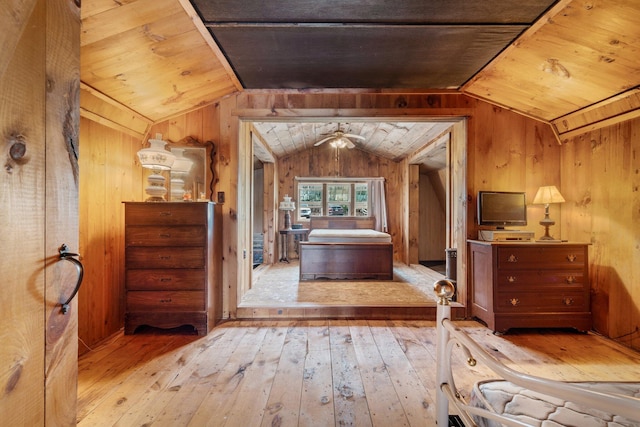 bedroom featuring wood walls, vaulted ceiling, wood ceiling, and hardwood / wood-style flooring
