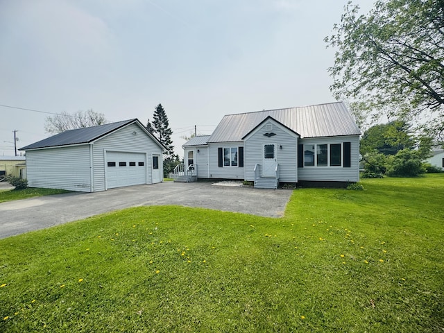 10 Laurette Cir, Caribou, ME 04736 - view of front of home with an outbuilding, metal roof, a garage, asphalt driveway, and entry steps