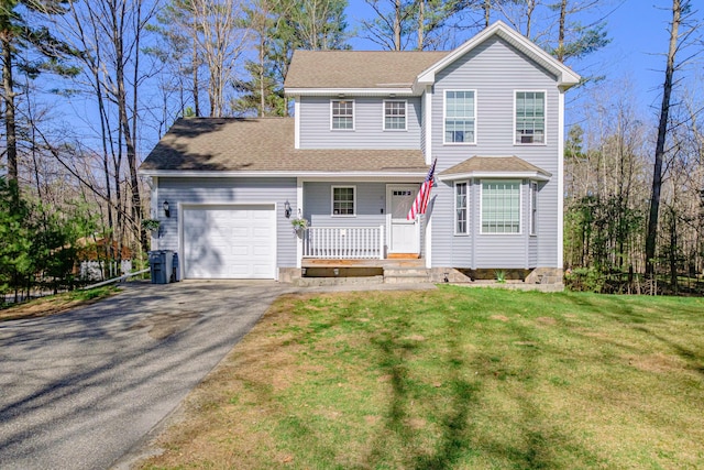 11 Sunny Brook Cir, Waterboro, ME 04061 - traditional-style house with covered porch, driveway, a front yard, a garage, and a shingled roof