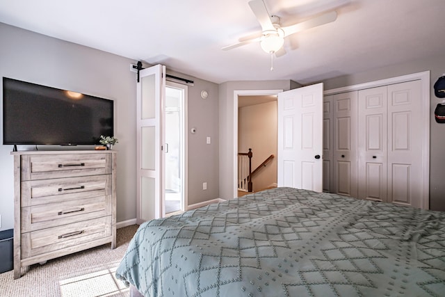 11 Sunny Brook Cir, Waterboro, ME 04061 - carpeted bedroom featuring a closet, baseboards, a ceiling fan, and a barn door