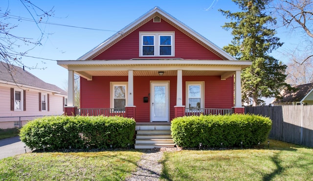 550 Ohio St, Bangor, ME 04401 - bungalow-style house featuring a porch, fence, and a front yard