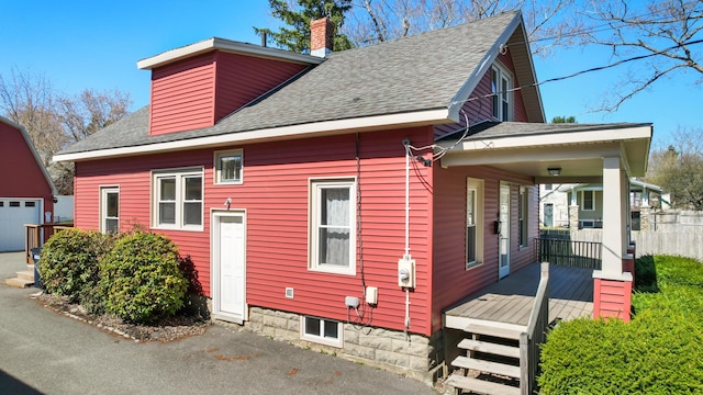 550 Ohio St, Bangor, ME 04401 - back of house with an outbuilding, a chimney, and a shingled roof