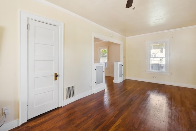 550 Ohio St, Bangor, ME 04401 - spare room with a ceiling fan, visible vents, crown molding, baseboards, and dark wood-style floors
