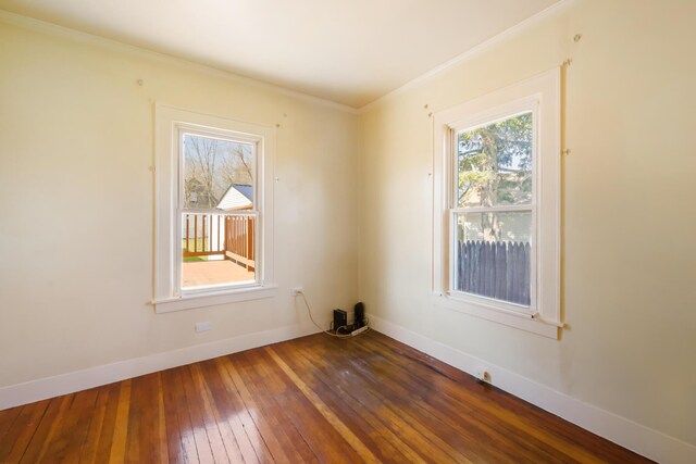550 Ohio St, Bangor, ME 04401 - spare room with baseboards, ornamental molding, and hardwood / wood-style flooring