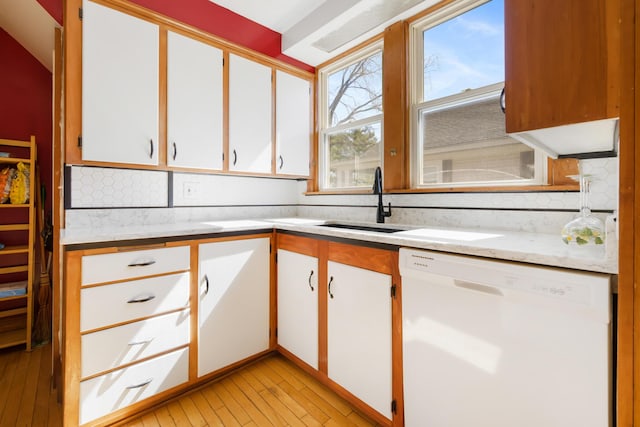 550 Ohio St, Bangor, ME 04401 - kitchen with a sink, white cabinets, backsplash, and dishwasher